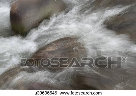 Water splashing on rocks in Vail, Colorado View Large Photo Image Stock Photography - Water splashing on rocks in Vail, Colorado. Fotosearch