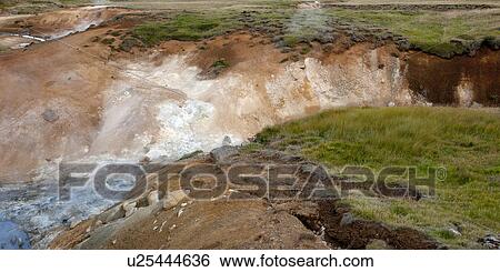 Stock Photograph - White water river gorge cut into grassland. Fotosearch