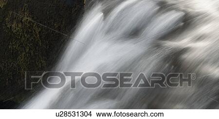 Picture - Whitewater cascade flow. Fotosearch