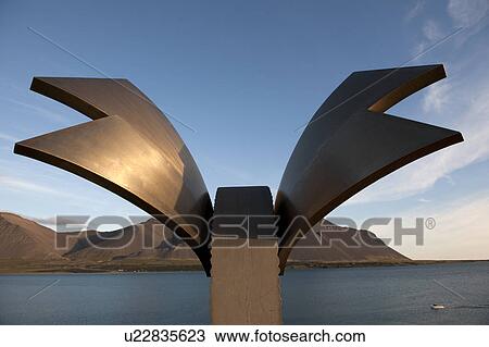 Stock Image - Winged sculpture on the overlooking the ocean. Fotosearch