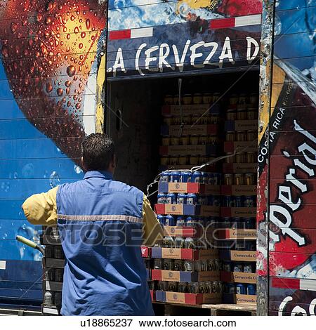 Worker unloading beverages in San Jose View Large Photo Image Stock Photo - Worker unloading beverages in San Jose. Fotosearch
