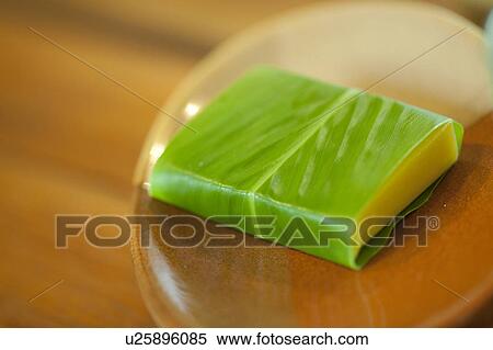 Yellow bar of soap wrapped in a green leaf sitting in a wooden soap dish View Large Photo Image Stock Photography - Yellow bar of soap wrapped in a green leaf sitting in a wooden soap dish. Fotosearch