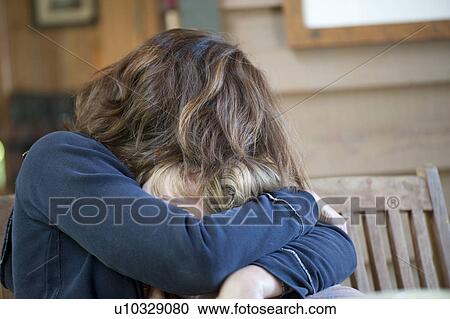 Young girl being hugged by her mother View Large Photo Image Stock Image - Young girl being hugged by her mother. Fotosearch