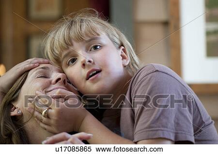 Young girl embracing her Mother View Large Photo Image Stock Photography - Young girl embracing her Mother. Fotosearch