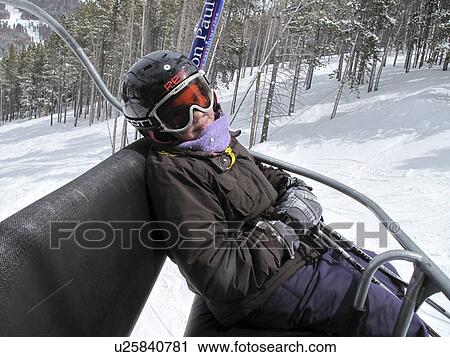 Stock Image - Young girl on the chairlift in Vail, Colorado. Fotosearch