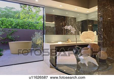 Stock Photo - Artwork of freestanding bath in California bathroom. Fotosearch