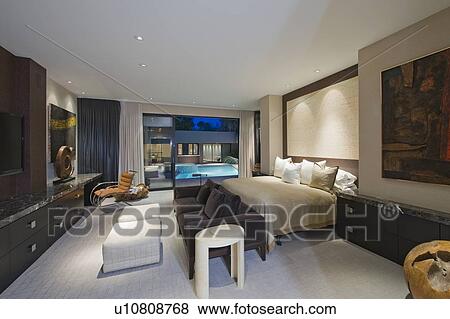 Lit bedroom of luxury California home View Large Photo Image Stock Photo - Lit bedroom of luxury California home. Fotosearch