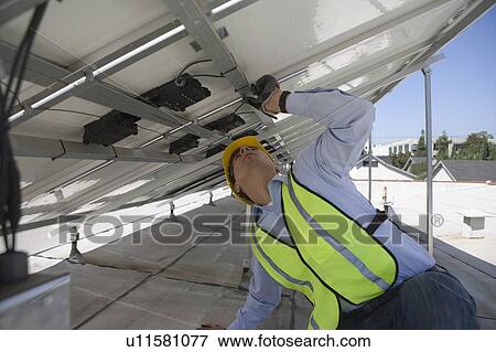 Maintenance worker adjusting solar panel in Los Angeles, California View Large Photo Image Stock Photo - Maintenance worker adjusting solar panel in Los Angeles, California. Fotosearch