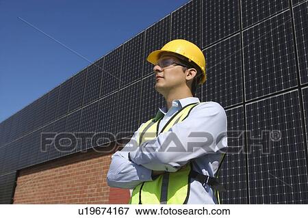 Stock Photo - Maintenance worker with photovoltaic array in Los Angeles, California. Fotosearch