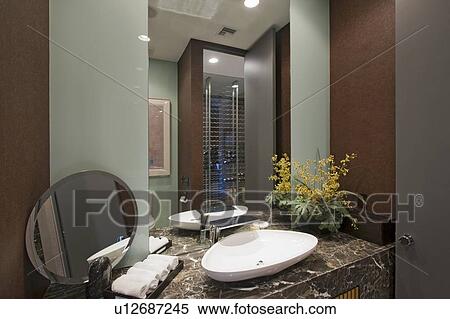 Stock Photography - Marble surround wash basin in California home. Fotosearch