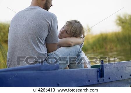 Young couple on blue painted boat, Russia View Large Photo Image Stock Image - Young couple on blue painted boat, Russia. Fotosearch