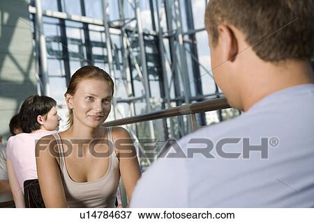 Young couple sit in food hall of shopping mall, Voronezh View Large Photo Image Stock Photo - Young couple sit in food hall of shopping mall, Voronezh. Fotosearch