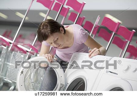 Young woman chooses washing machine in shopping mall, Voronezh View Large Photo Image Stock Image - Young woman chooses washing machine in shopping mall, Voronezh. Fotosearch