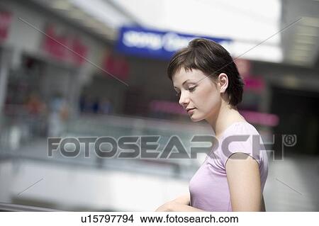Picture - Young woman in shopping centre, Voronezh. Fotosearch