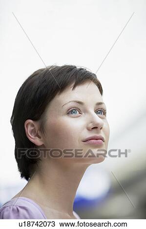 Stock Image - Young woman in shopping centre, Voronezh. Fotosearch