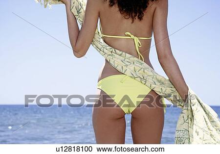 Backside of female young adult on the beach View Large Photo Image Stock Image - Backside of female young adult on the beach. Fotosearch