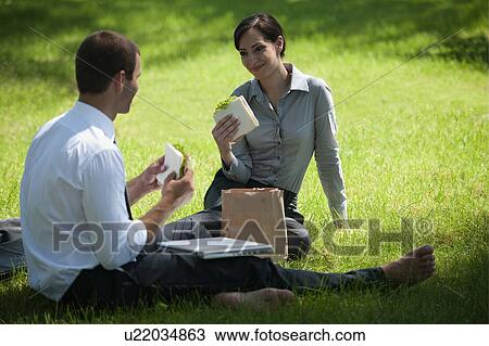 Business people eating lunch on grass View Large Photo Image Stock Image - Business people eating lunch on grass. Fotosearch