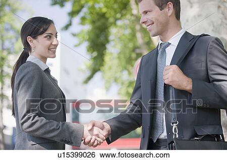 Stock Photograph - Business people shaking hands. Fotosearch