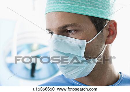 Close up of surgeon in operating room View Large Photo Image Stock Image - Close up of surgeon in operating room. Fotosearch