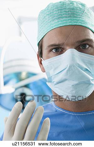 Close up of surgeon in operating room View Large Photo Image Stock Image - Close up of surgeon in operating room. Fotosearch