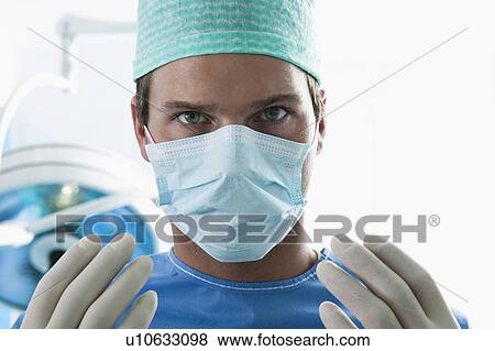 Close up of surgeon in operating room View Large Photo Image Stock Photo - Close up of surgeon in operating room. Fotosearch