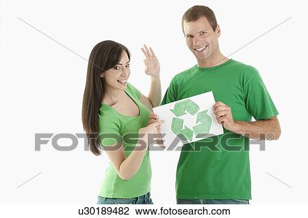 Couple holding recycling symbol drawing View Large Photo Image Stock Image - Couple holding recycling symbol drawing. Fotosearch