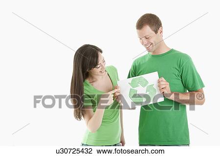 Couple holding recycling symbol drawing View Large Photo Image Stock Image - Couple holding recycling symbol drawing. Fotosearch