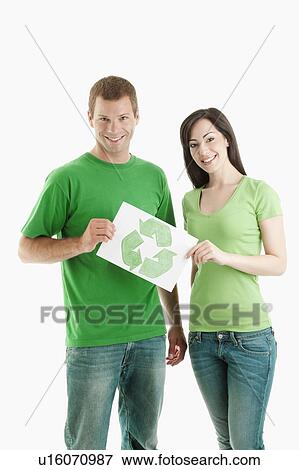 Stock Photo - Couple holding recycling symbol drawing. Fotosearch