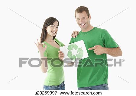 Couple holding recycling symbol drawing View Large Photo Image Stock Photo - Couple holding recycling symbol drawing. Fotosearch