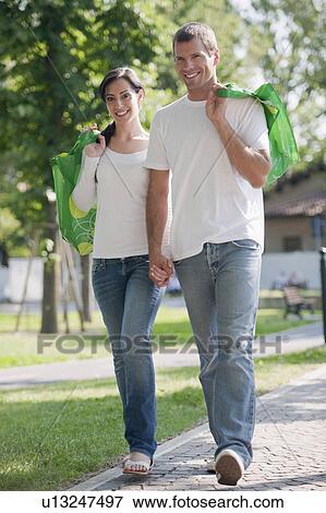 Couple with reusable shopping bags outdoor View Large Photo Image Stock Photo - Couple with reusable shopping bags outdoor. Fotosearch