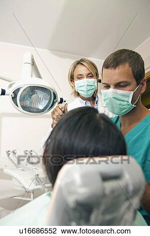 Dental professionals with patient View Large Photo Image Stock Image - Dental professionals with patient. Fotosearch