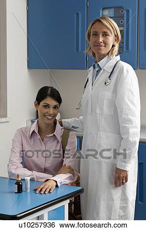 Stock Photograph - Doctor and patient in office. Fotosearch