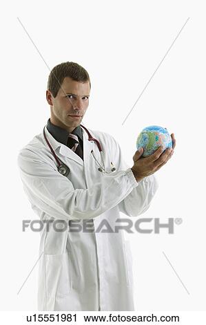 Stock Image - Doctor holding globe . Fotosearch