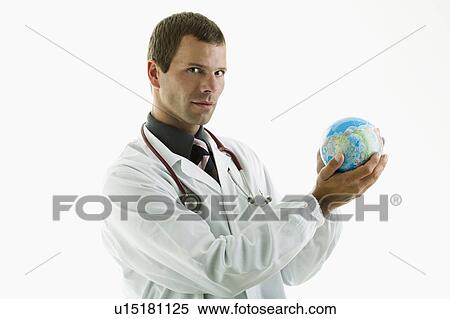 Stock Photography - Doctor holding globe . Fotosearch