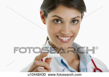 Doctor holding medicine device View Large Photo Image Stock Image - Doctor holding medicine device. Fotosearch