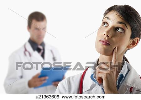 Doctor questioning and doctor with medical chart View Large Photo Image Stock Photography - Doctor questioning and doctor with medical chart. Fotosearch