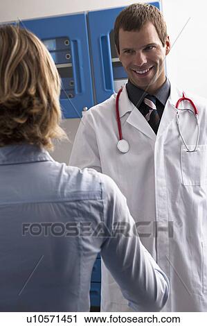 Doctor shaking hands with patient View Large Photo Image Stock Image - Doctor shaking hands with patient. Fotosearch