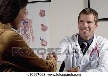 Doctor shaking hands with patient View Large Photo Image Stock Photo - Doctor shaking hands with patient. Fotosearch