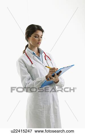 Stock Photo - Doctor wearing stethoscope and writing on chart. Fotosearch