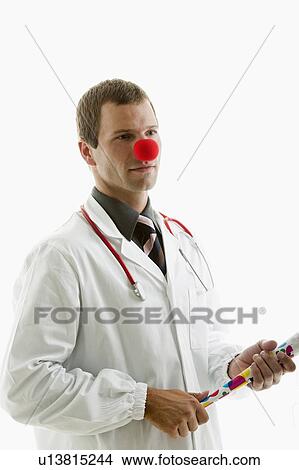 Picture - Doctor with stethoscope and clown's nose. Fotosearch