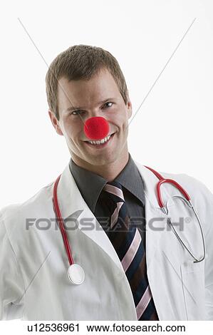 Doctor with stethoscope and clown's nose View Large Photo Image Stock Image - Doctor with stethoscope and clown's nose. Fotosearch