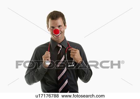 Doctor with stethoscope and clown's nose View Large Photo Image Stock Photo - Doctor with stethoscope and clown's nose. Fotosearch