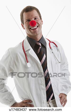 Stock Photo - Doctor with stethoscope and clown's nose. Fotosearch