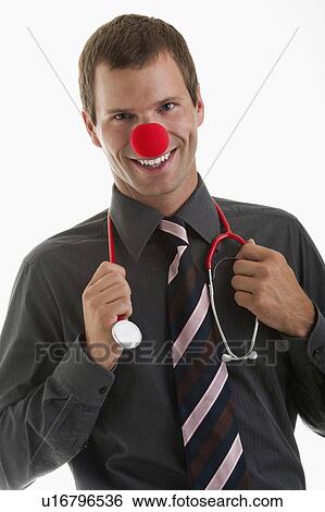 Stock Photograph - Doctor with stethoscope and clown's nose. Fotosearch