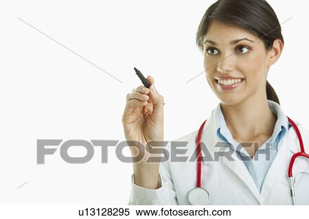 Stock Photography - Doctor writing with pen. Fotosearch