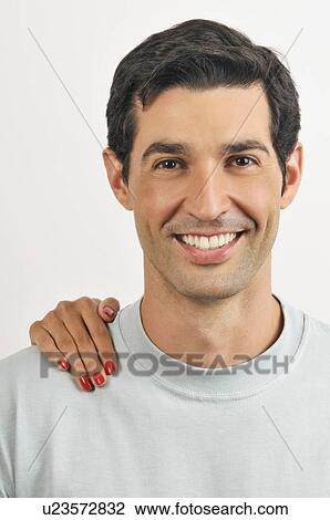 Female hand on young adult male's shoulder View Large Photo Image Stock Image - Female hand on young adult male's shoulder. Fotosearch