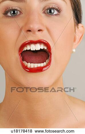 Stock Photo - Female young adult face; screaming. Fotosearch