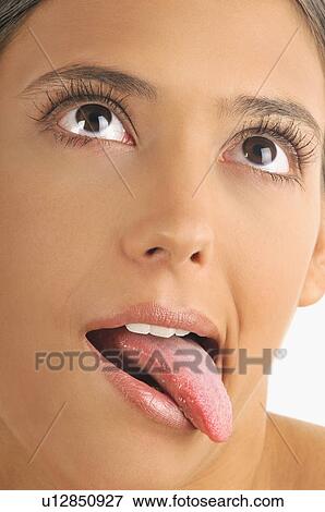 Female young adult face; tongue out View Large Photo Image Stock Photo - Female young adult face; tongue out. Fotosearch