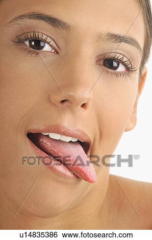 Female young adult face; tongue out View Large Photo Image Stock Photograph - Female young adult face; tongue out. Fotosearch