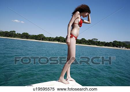 Female young adult looking into sea View Large Photo Image Stock Photography - Female young adult looking into sea. Fotosearch